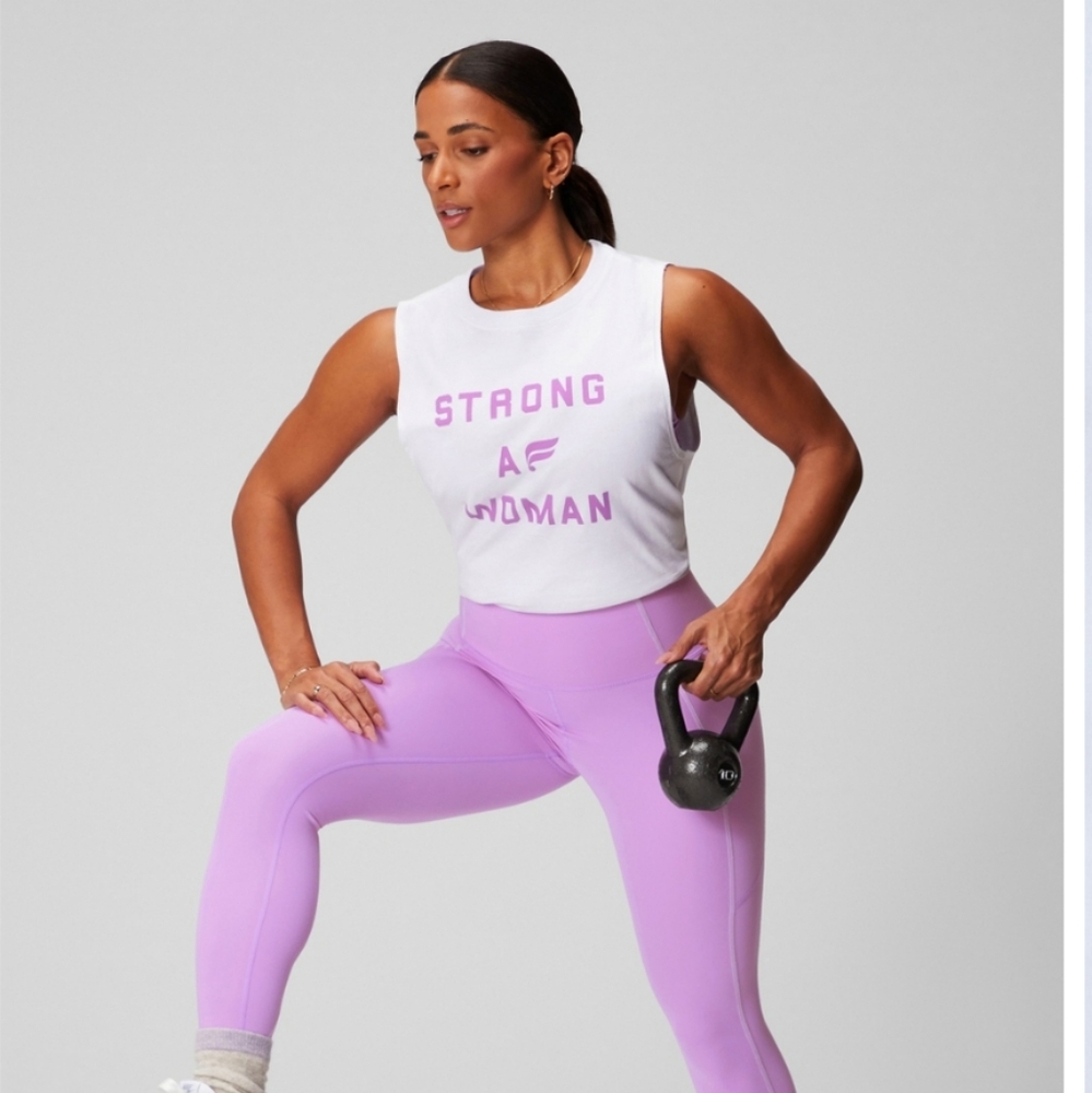 Fabletics White Muscle Tee with Pink Print. International Women's Day